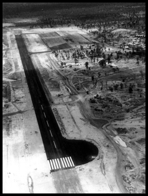 A black and white aerial shot of the completed tarmac strip.