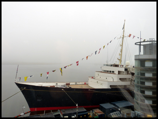 The bows of the Royal Yatch Brittania with a backdrop of mist.