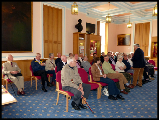 The audience wait patiently for the arrival of Rebecca Nash.