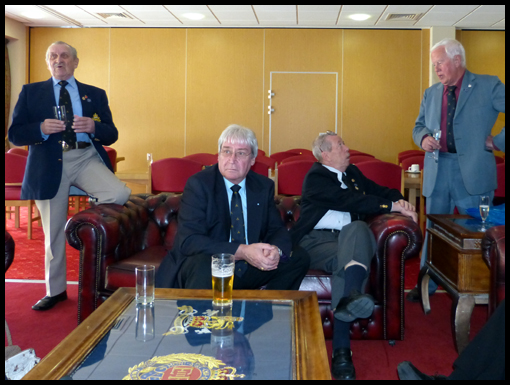 Members wait in the bar to be called for lunch.