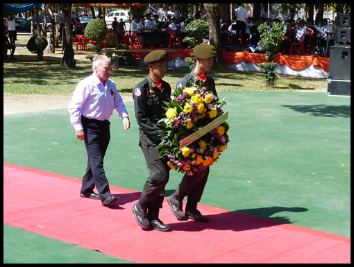 Frank Moggach marches behind his escort to lay the Operation Crown wreath.