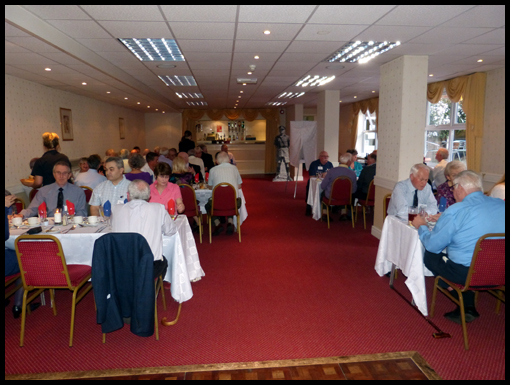 Members sit for the evening meal on the first day of the reunion.