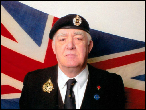 Jim Parker stands in front of the Union jack he 'liberated' from Crown