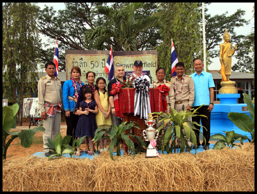 VIP's stand and pose for the photographer.