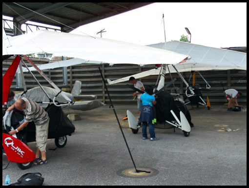 Tying the aircraft down to protect them from being blown away.