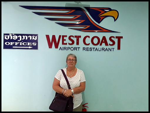 Gill Allison poses for Hubby Dave in front of the Airport sign.