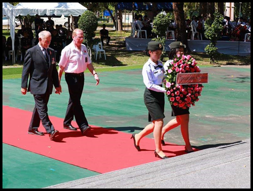 Jim Curtis and John Hamnett escort the OCA wreath to the podium.