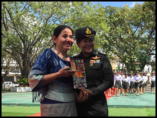 Khamma and Ammy hold a copy of her book,