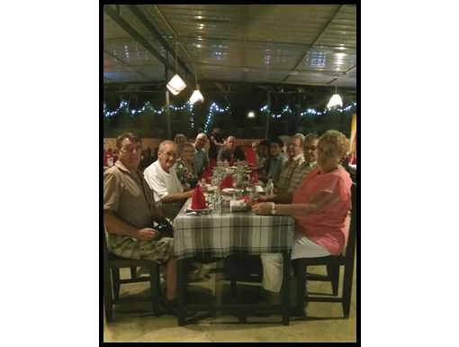 The travellers sit down to their last dinner in Luang Prabang