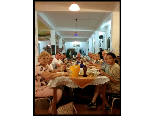 The travellers eat the last dinner and drink the last beer in Vang Vieng