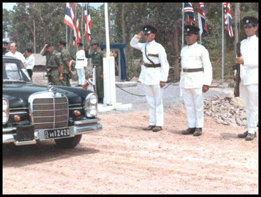 Peter davidson leads the salute as Air Chief Marshal Dawee Chullasapya leaves Nong Phoc for Crown Airfield.