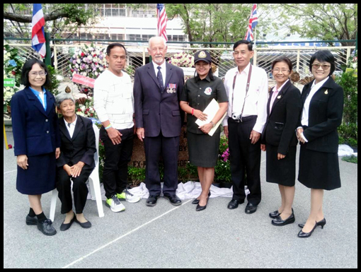 Jim Curtis with the family of Little Mother Ubon, the rollover shows Old Tom and LMU