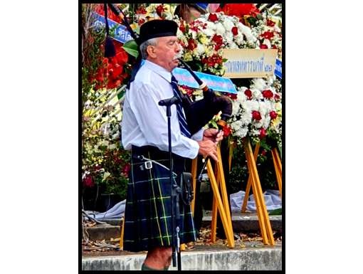 Neil Campbell plays 'Flowers of the Forest' as the wreaths are laid.