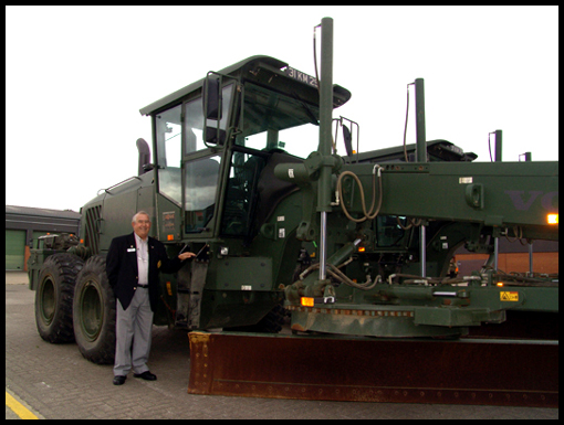 Peter Limb standing beside a grader at 22 Engineer Regt in 2009