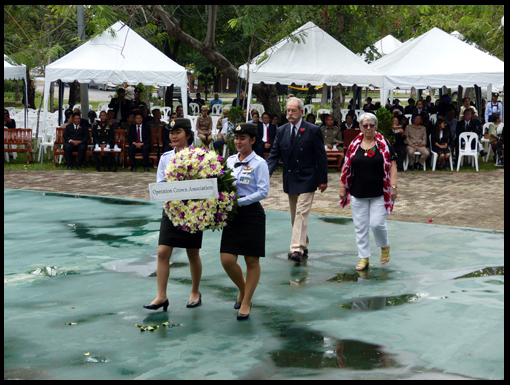 Gill Allison and David Higgins escort the OCA wreath to the Podium.