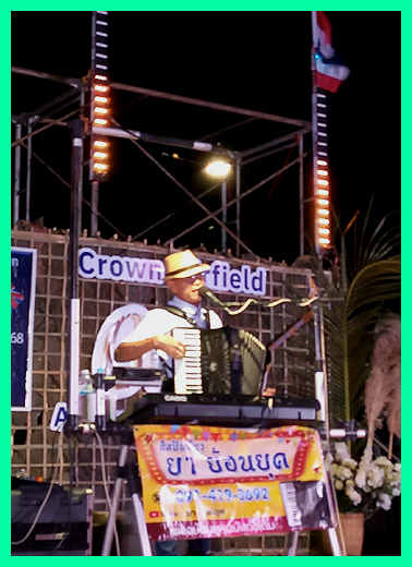 A DJ accordanist performs for his audience.