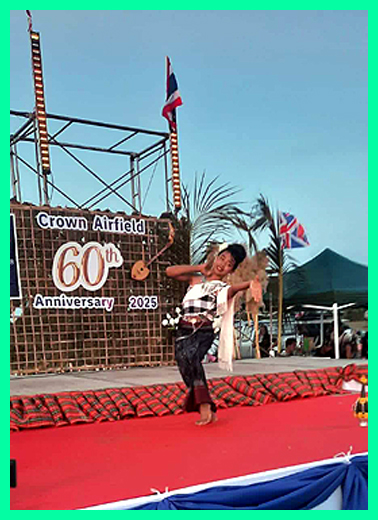 A young dancer performs tradional Thai dance