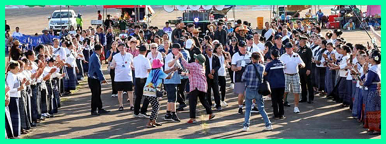 The OCA group and other VIP guests sit on the stage.