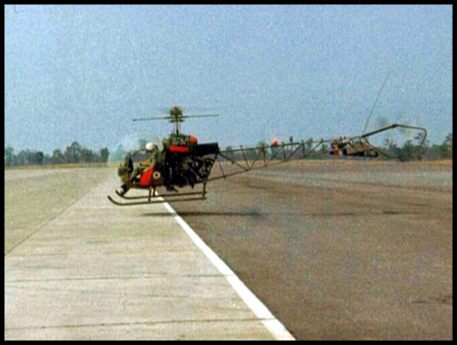 Tony Bold takes a ride in a Sioux helicopter to take pictures of the road.