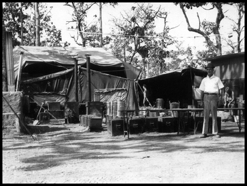 Sgt Couls ACC stands at his field kitchen inthe tented camp of Operation Crown.