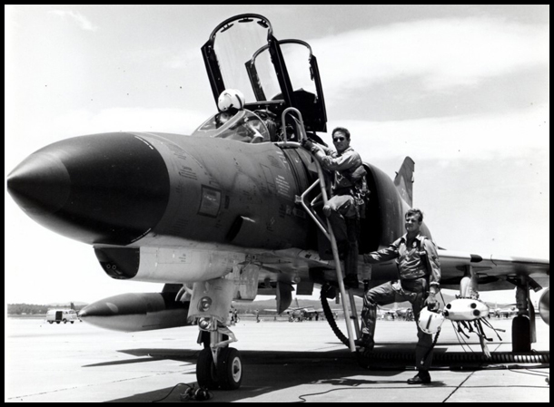Pilot Rogers and Navigator Best mount the steps to the cockpit of their RAAF Phantom