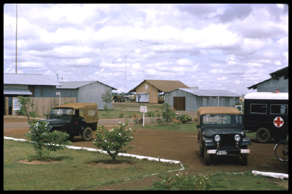 An image of two RAAF jeeps and an ambulance outside the Medical Center